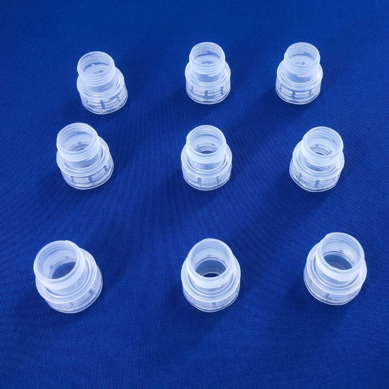 Eight PP translucent threaded bottle caps produced by automatic unscrewing mold, showing consistent thread quality and no parting line marks, ABERY China for Italian packaging customer