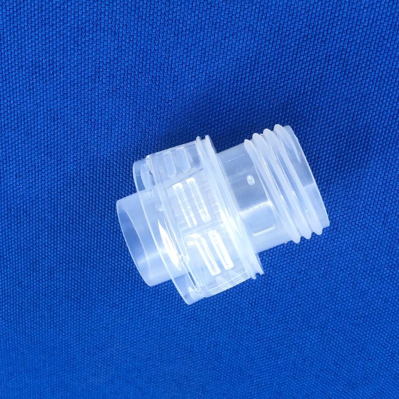Underside view of PP threaded connector showing complete external thread with no slider parting line, manufactured by ABERY unscrewing mold process